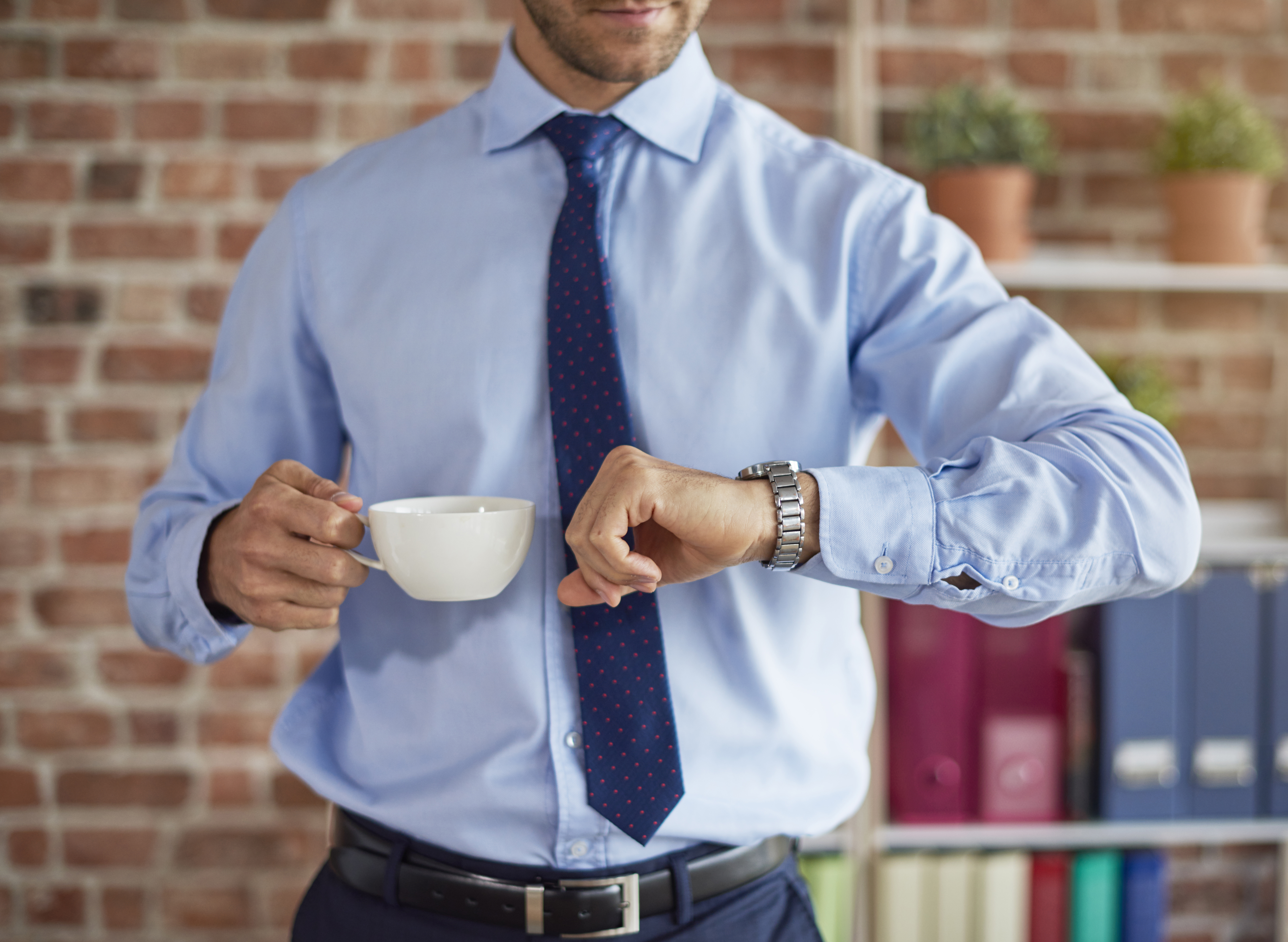 man-checking-time-his-watch