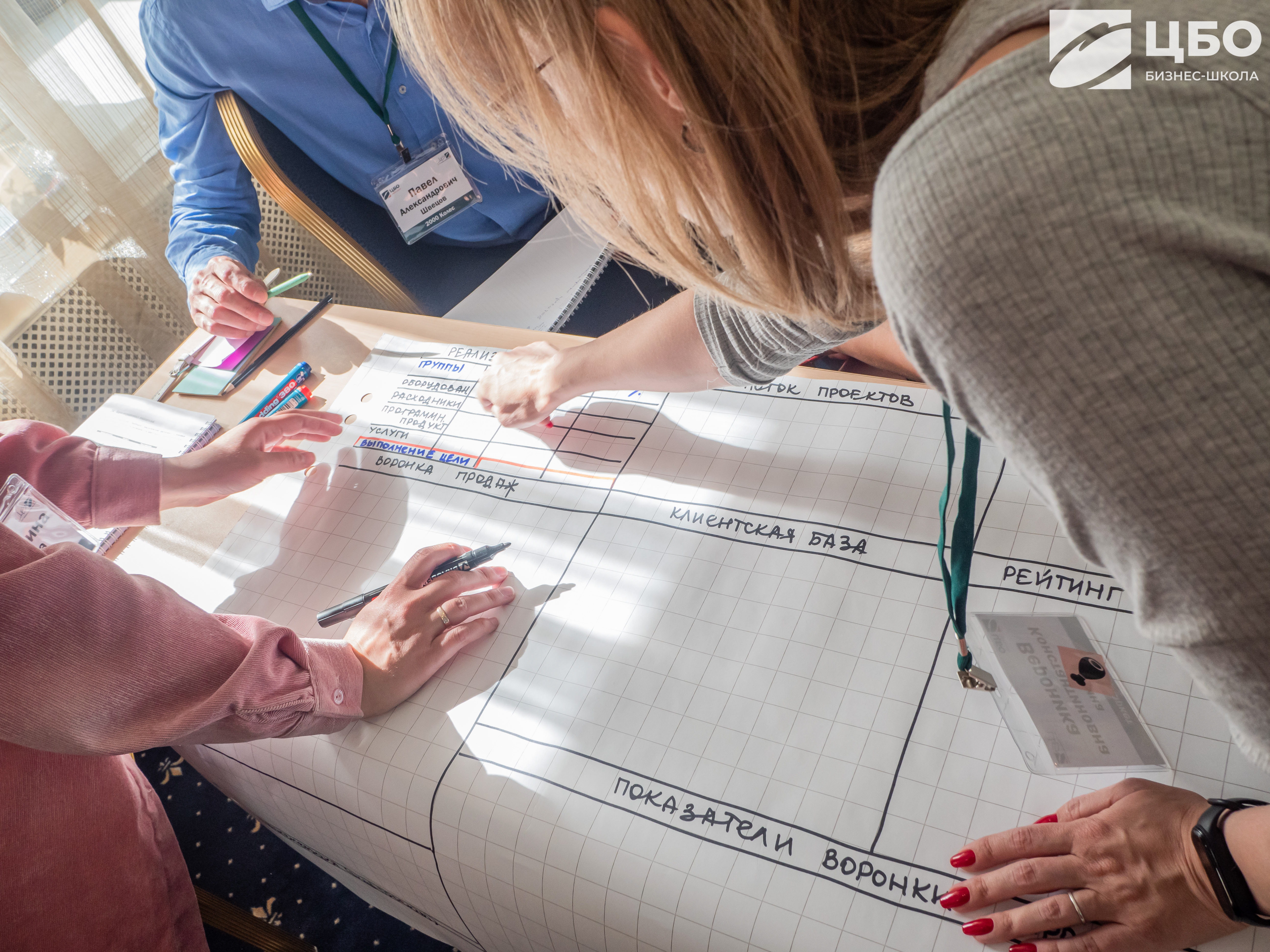students-fill-out-a-table-on-paper