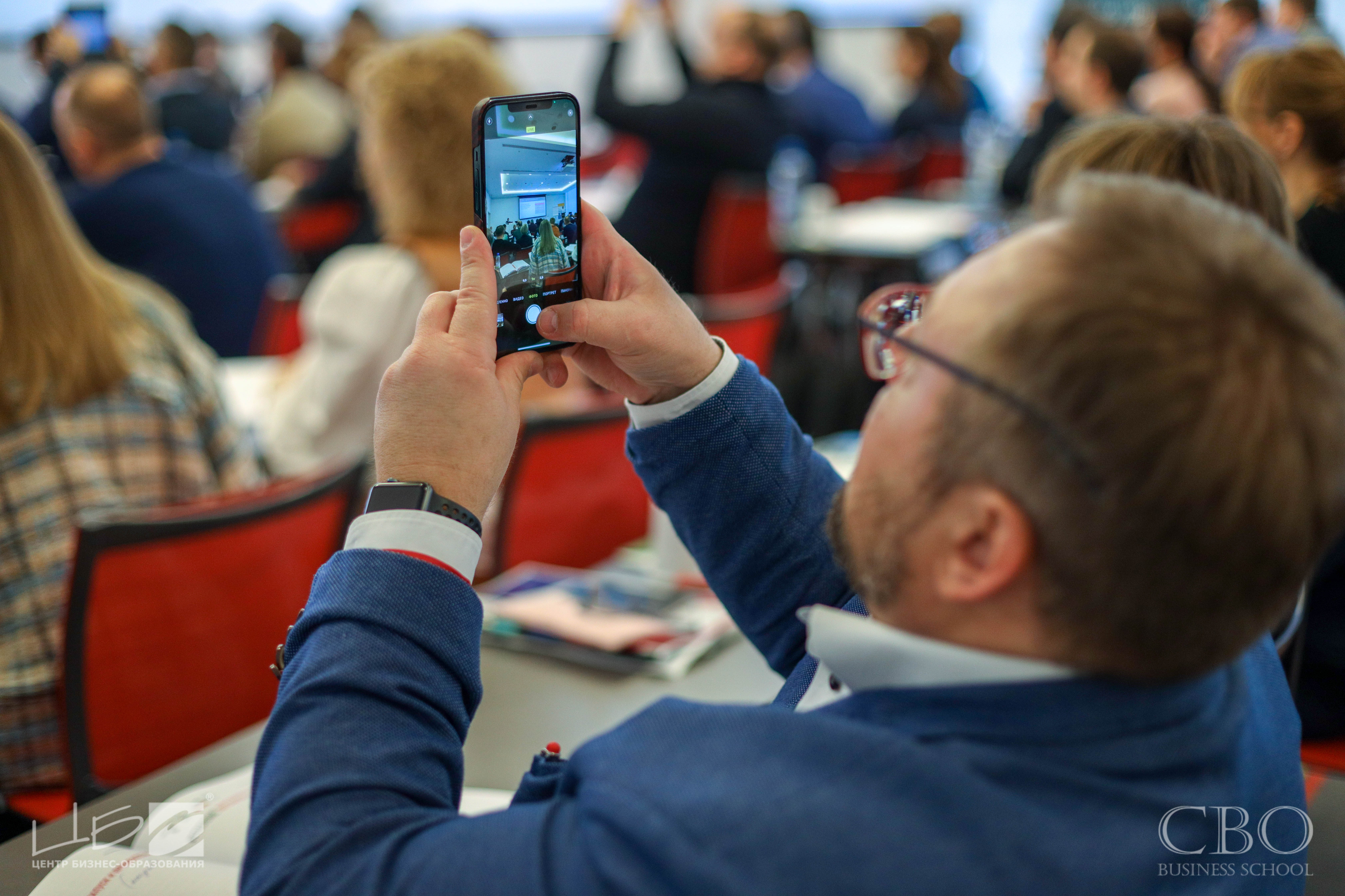 student-taking-a-photo-of-a-presentation
