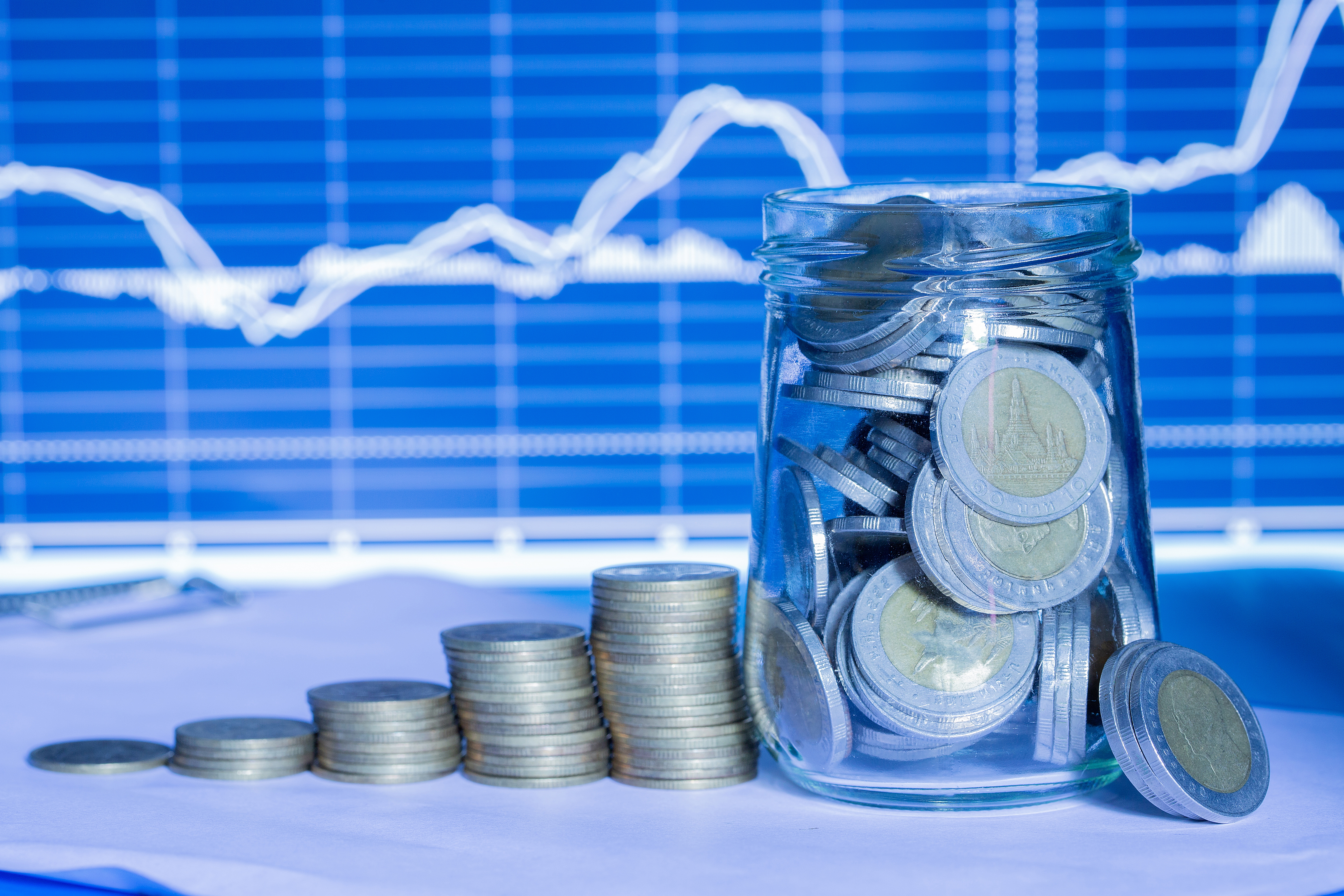 coins-bottles-with-trading-graph