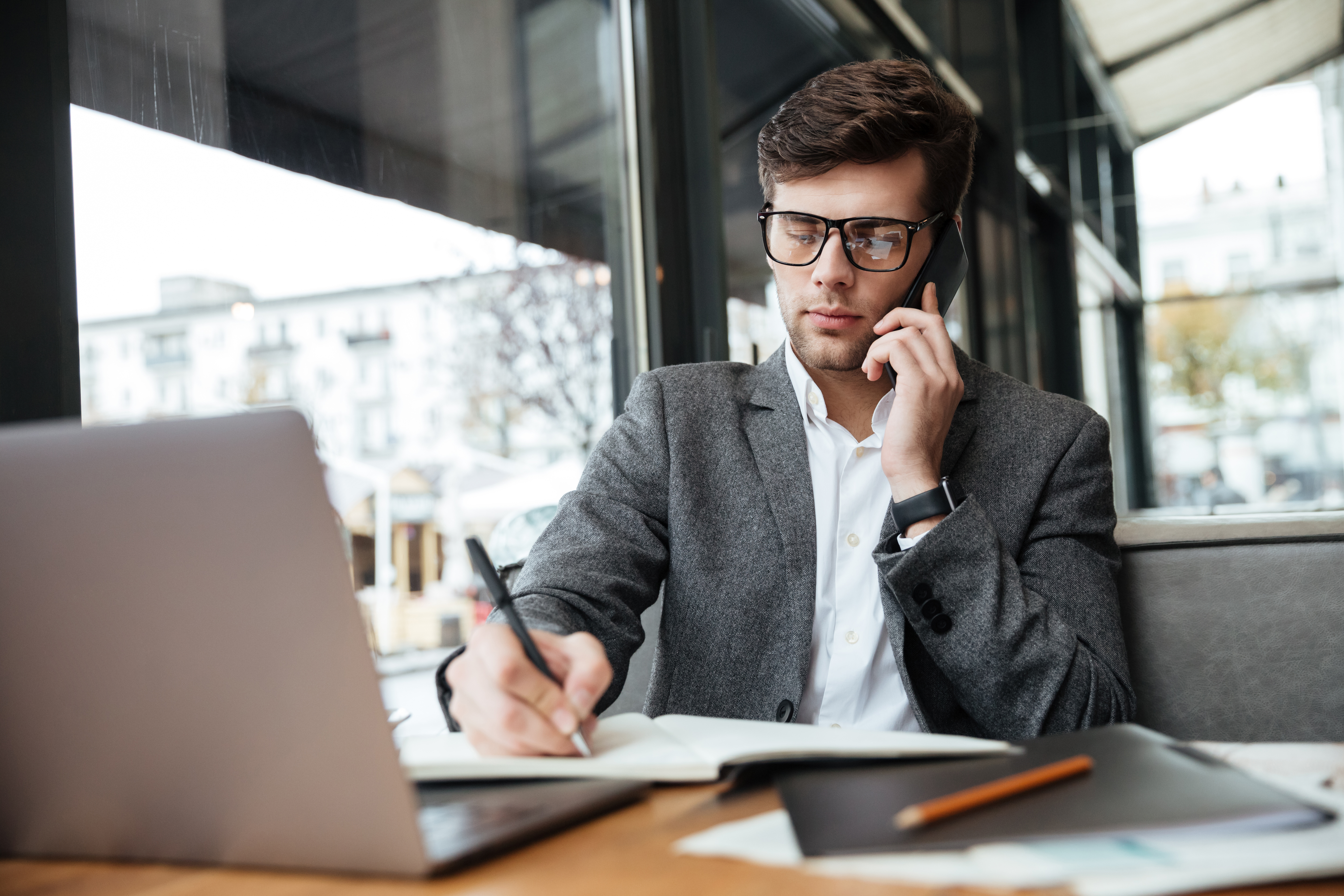 businessman-sitting-by-table