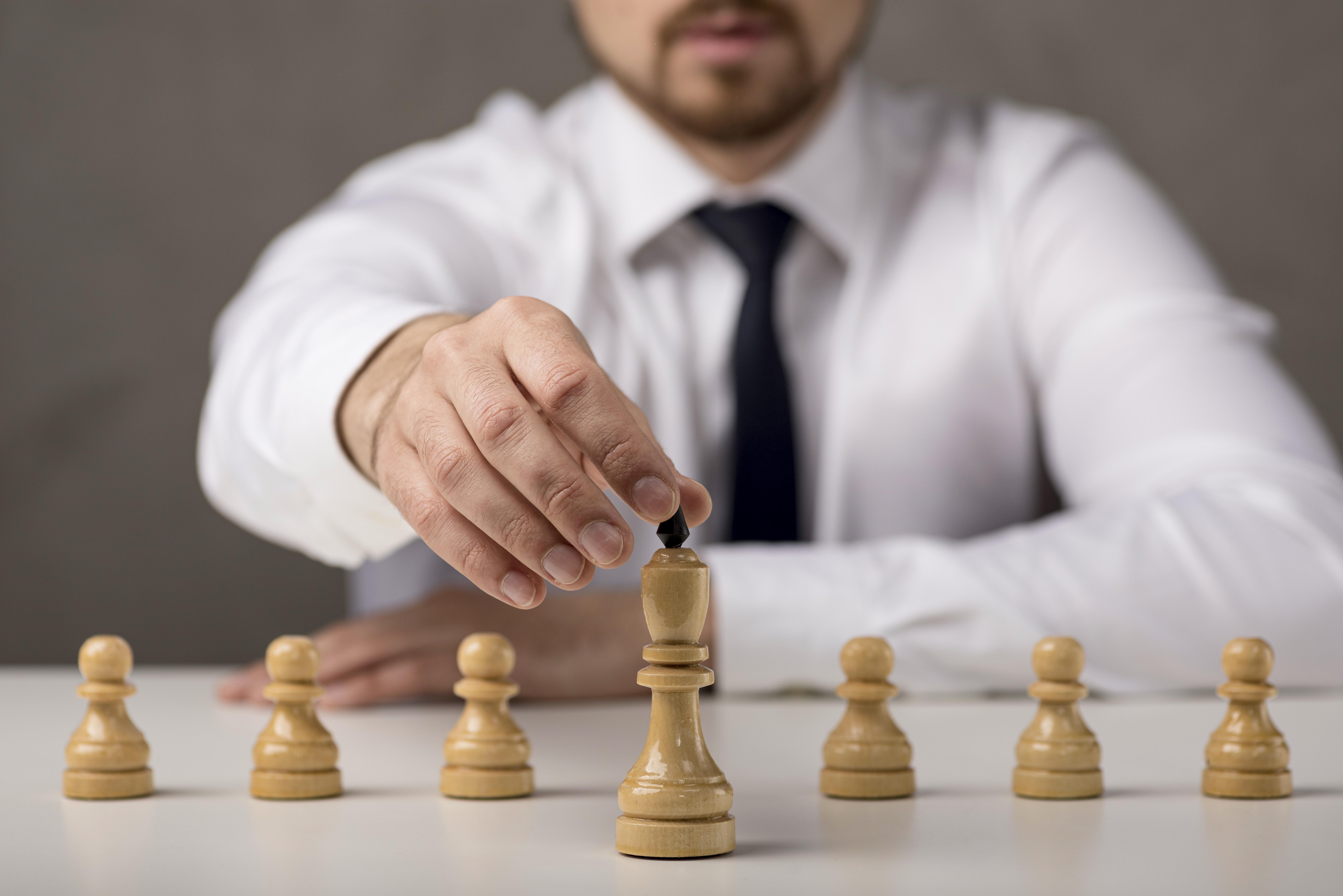 front-view-businessman-holding-king