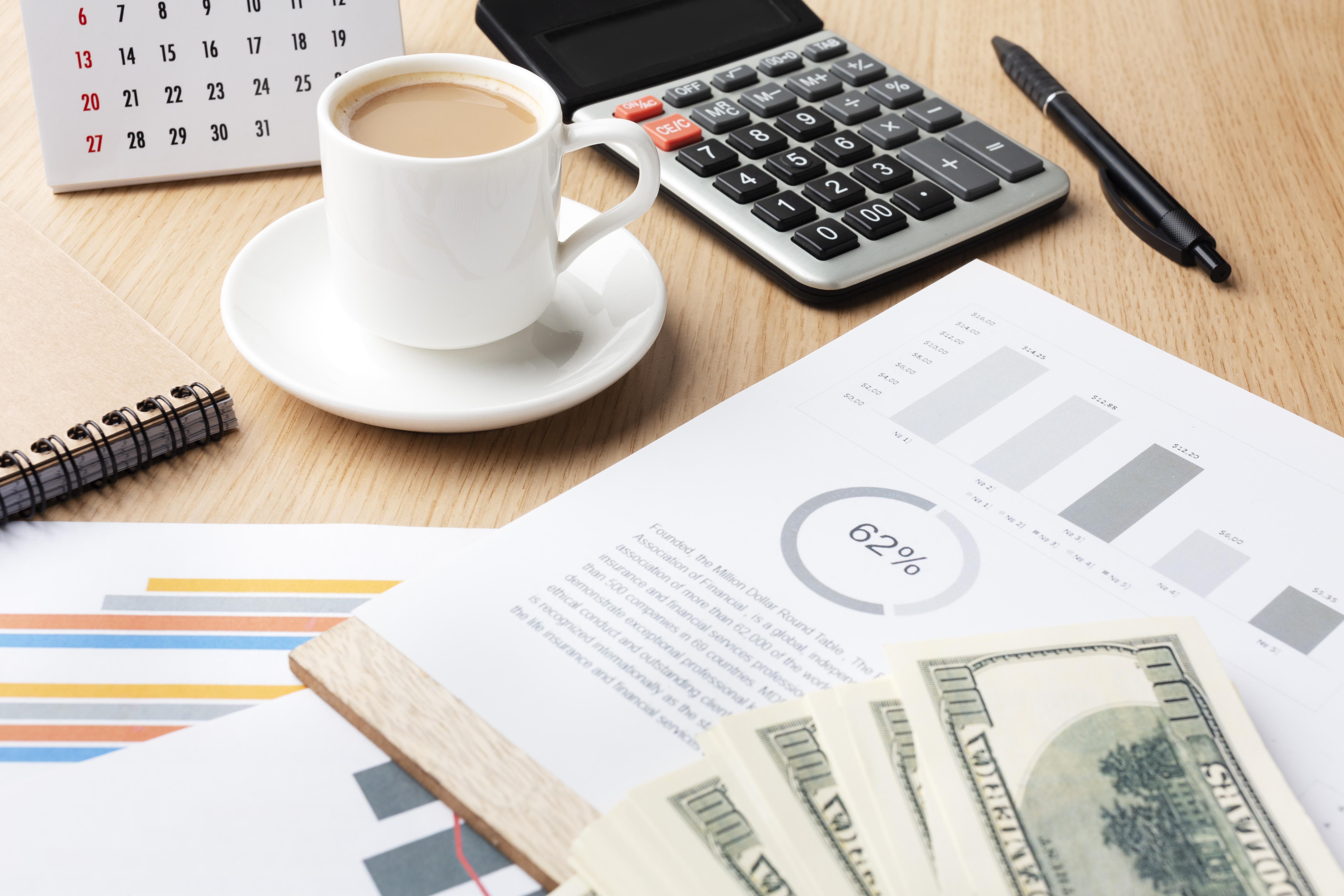 high-angle-desk-with-cash-coffee